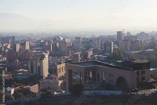 Yerevan, Armenia, beautiful super-wide angle panoramic view of Yerevan with Mount Ararat, cascade complex, mountains and scenery beyond the city, summer sunny day photo