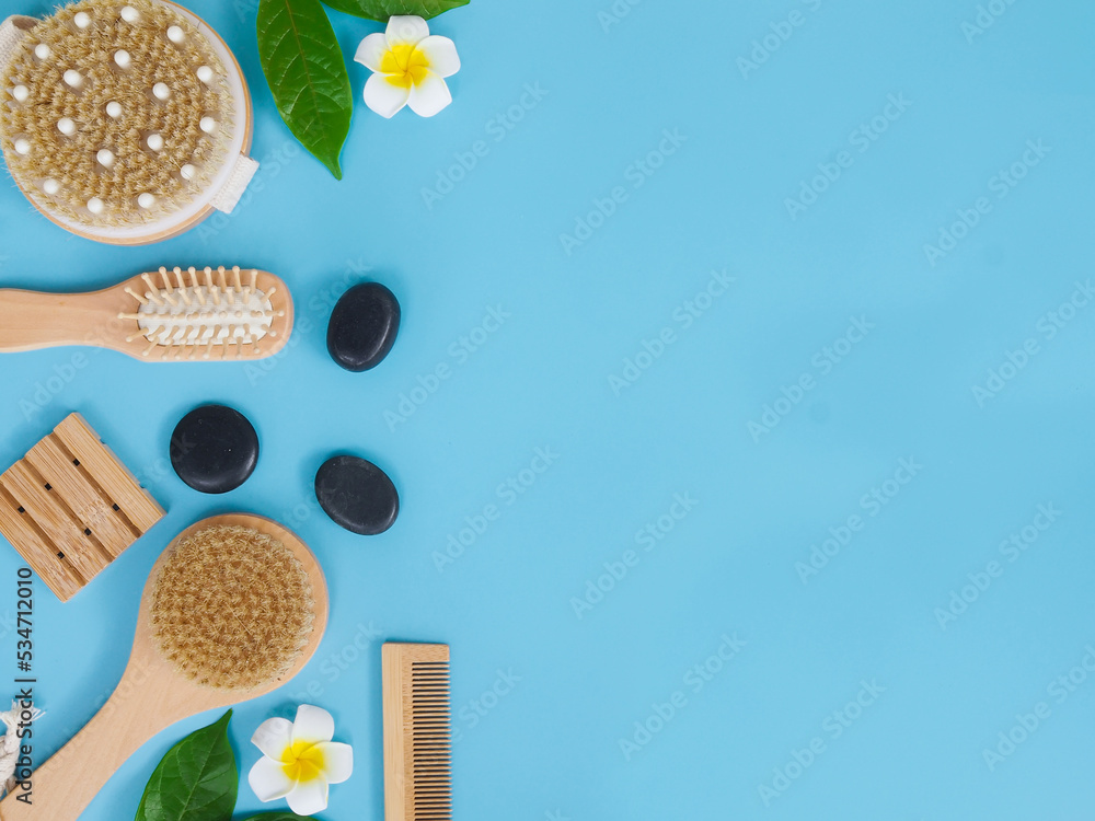 Directly above view of spa products on blue background, Healthcare spa concept with copy space