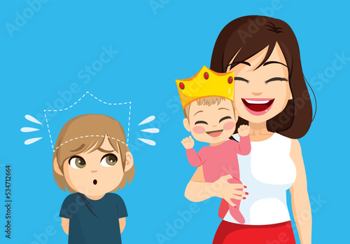 Cute little son boy feeling bad dethroned by new baby on family. Unhappy kid jealousy concept