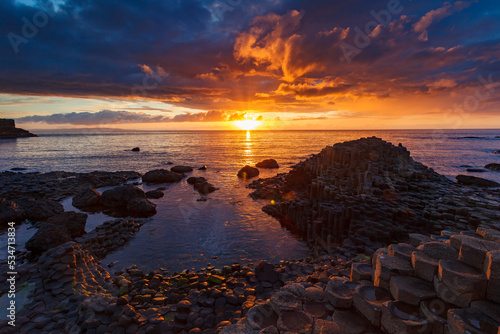 sunset over the sea at Gaint´s Causeway in Ireland