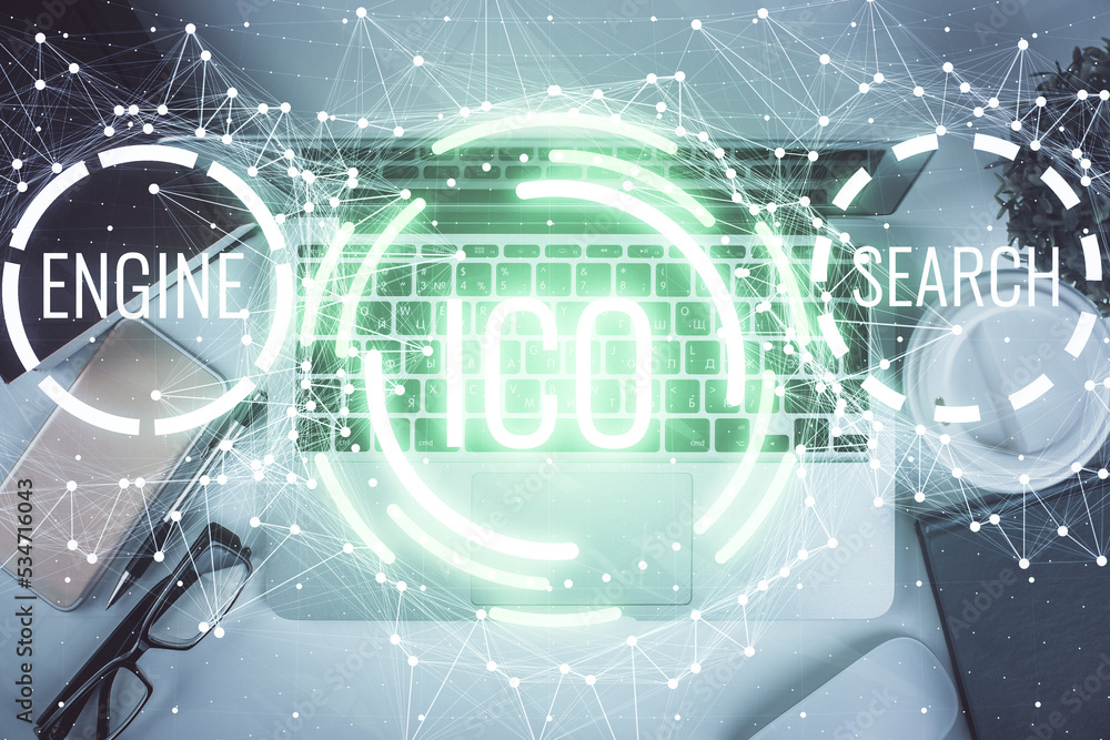 Blockchain theme hologram drawings over computer on the desktop background. Top view. Double exposure. Blockchain theme hologram drawings over computer on the desktop background. Top view. Double exposure.