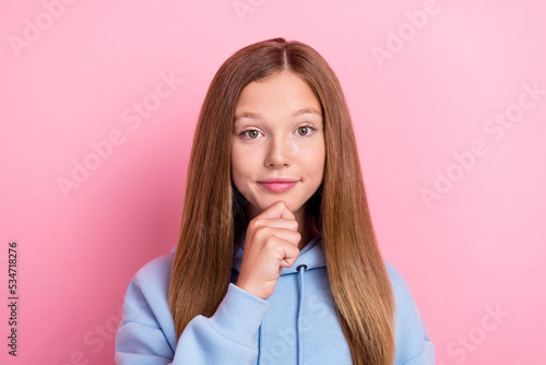 Closeup photo of young pretty nice positive smart lady schoolgirl wear blue hoodie touch chin minded focused look you isolated on bright pink color background