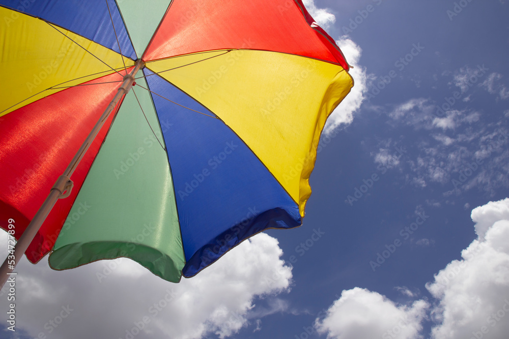 Beautiful umbrellas on the beach and sunny sky.