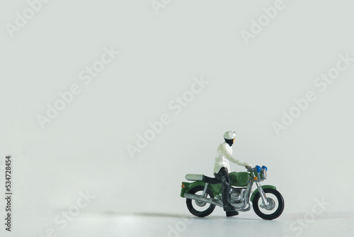 Policeman on a motorcycle isolated on white background
