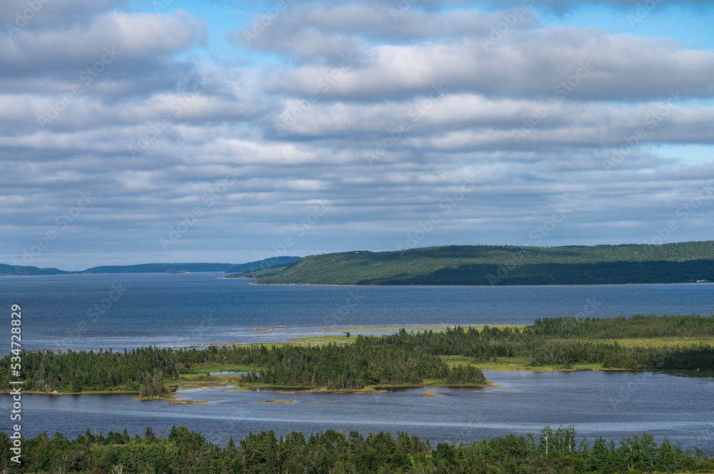 Canada, Newfoundland - Labrador, Lumsden, White puffy clouds over ocean coast Canada, Newfoundland - Labrador, Lumsden, White puffy clouds over ocean coast