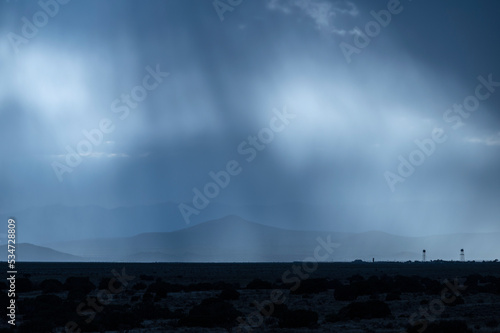 Usa, New Mexico, Santa Fe, Monsoon rainstorm in desert landscape photo