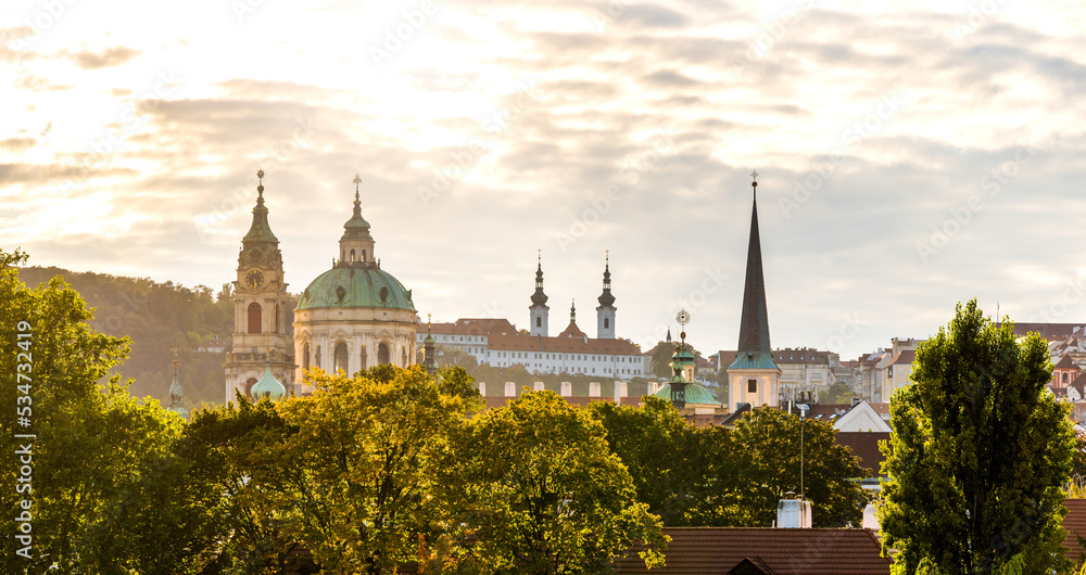 European Baroque Architecture St. Nicholas Church and Strahov Monastery and Library at Sunset, Prague Cityscape, the Capital of the Czech Republic