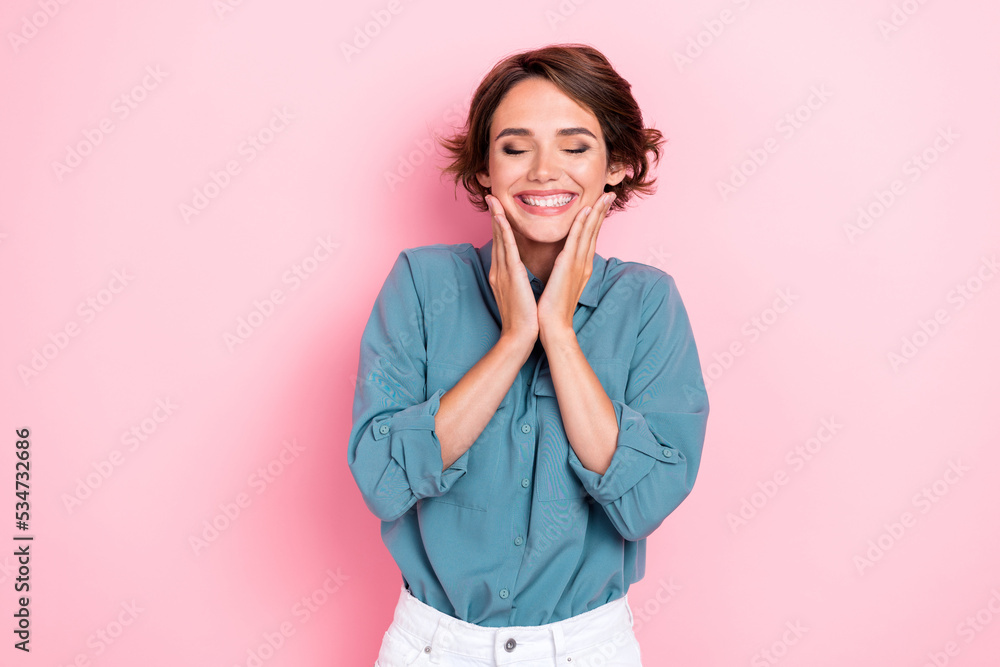 Photo portrait of gorgeous young lady touch face closed eyes enjoy soft skin dressed trendy blue look isolated on pink color background Photo portrait of gorgeous young lady touch face closed eyes enjoy soft skin dressed trendy blue look isolated on pink color background