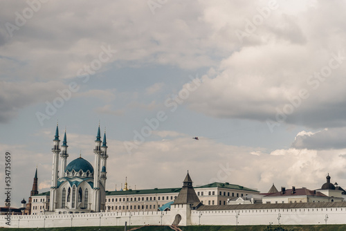 Plane over the Kazan city on white background. Summer travel landscape. Urban modern landscape. High speed.