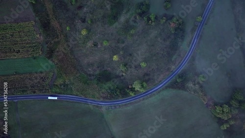 Road seen from above. Aerial shot with car on road