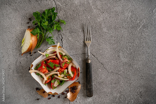 tomato salad. dish flatley on a gray background photo