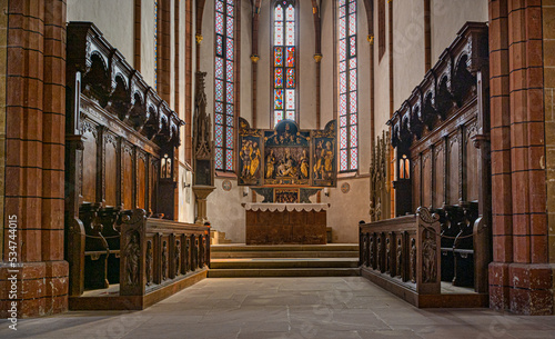 Interior view of the evangelical town church of Bad Wimpfen, view of choir stalls and altar. Neckartal, Baden-Wuerttemberg, Germany, Europe photo