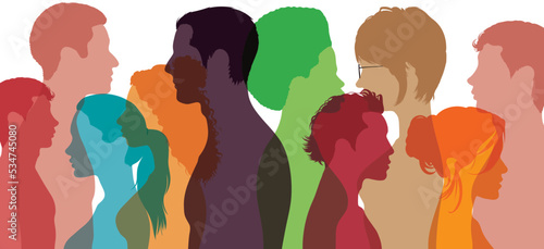 People talking in the crowd. People of different ages and ethnic groups talking to each other. Diversity between people.