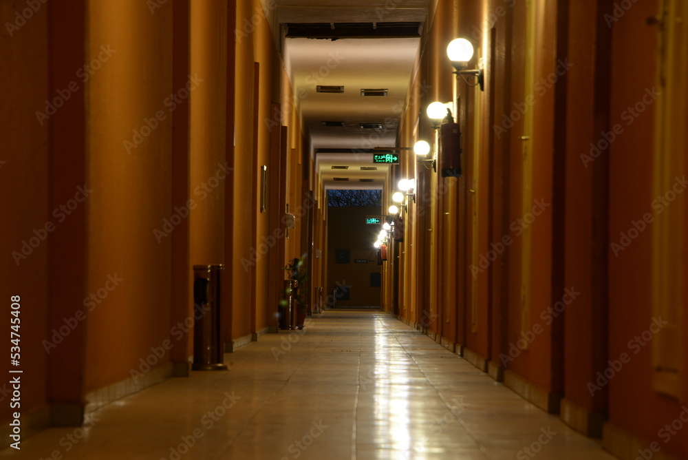 corridor of one of the hotels illuminated by lamps