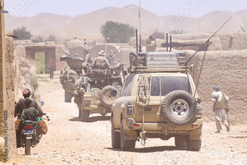 military patrol convoy in the village photo