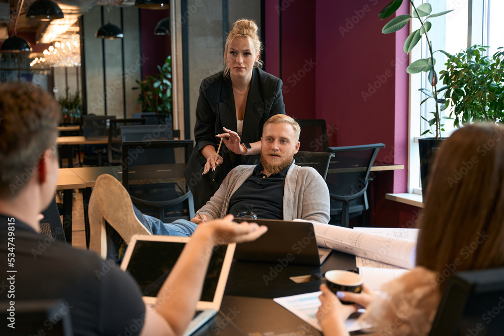 Architectural team manager holding meeting with his staff Architectural team manager holding meeting with his staff