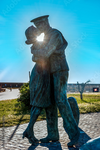 Wallpaper Mural The Bronze Made Statue of A Sailor that Kisses a Lady in the Port of Civitavecchia, near Rome, Italy Torontodigital.ca