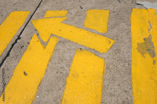 yellow arrow sign