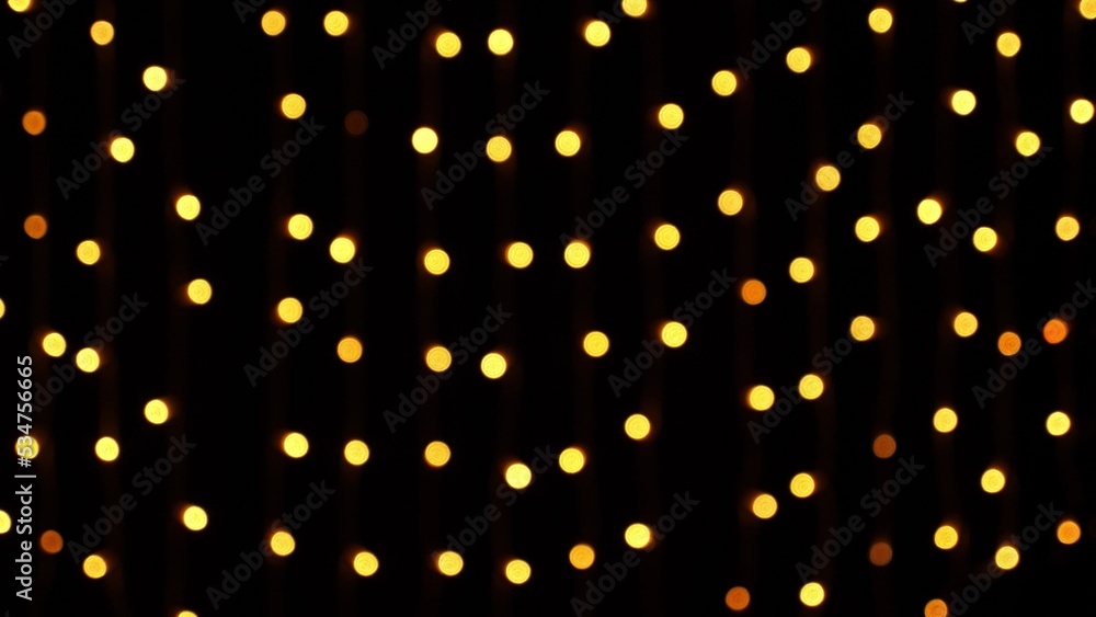Abstract bokeh background in motion. shining, blurred golden particles, lights. bright bokeh from garlands on dark background. New year or Christmas festive backdrop. High quality photo Abstract bokeh background in motion. shining, blurred golden particles, lights. bright bokeh from garlands on dark background. New year or Christmas festive backdrop. High quality photo