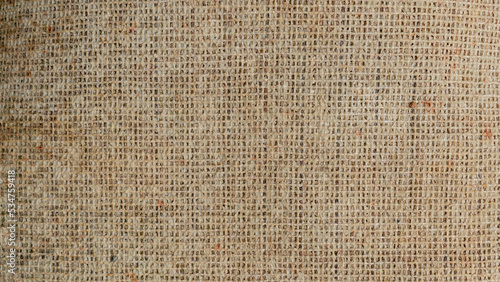 Background and textured of brown rough cloth. Detail of visible fluff and fibers.