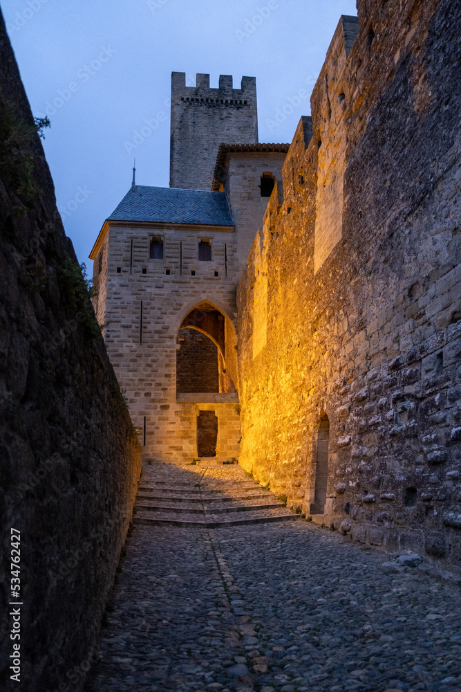 Historic Fortified Medieval City of Carcassonne, Aude, Occitanie, South France. Unesco World Heritage Site. Detail ilumination during the night