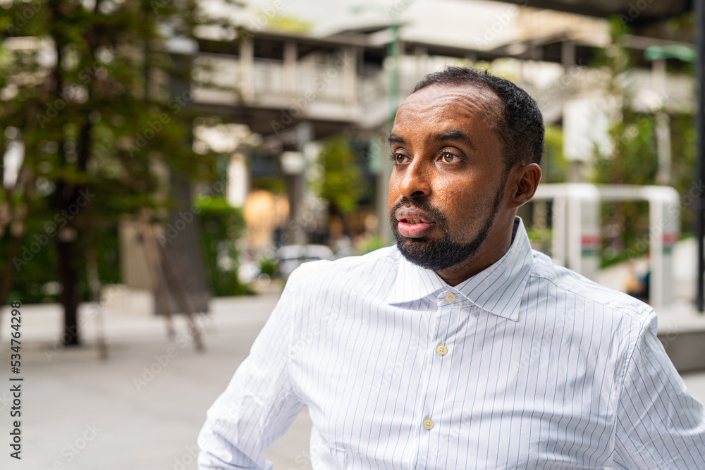 Portrait of handsome black man in city ready for business Portrait of handsome black man in city ready for business