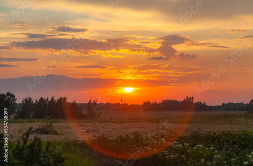 Fototapeta Naklejka Na Ścianę i Meble -  Landscape with sunset in the village in summer