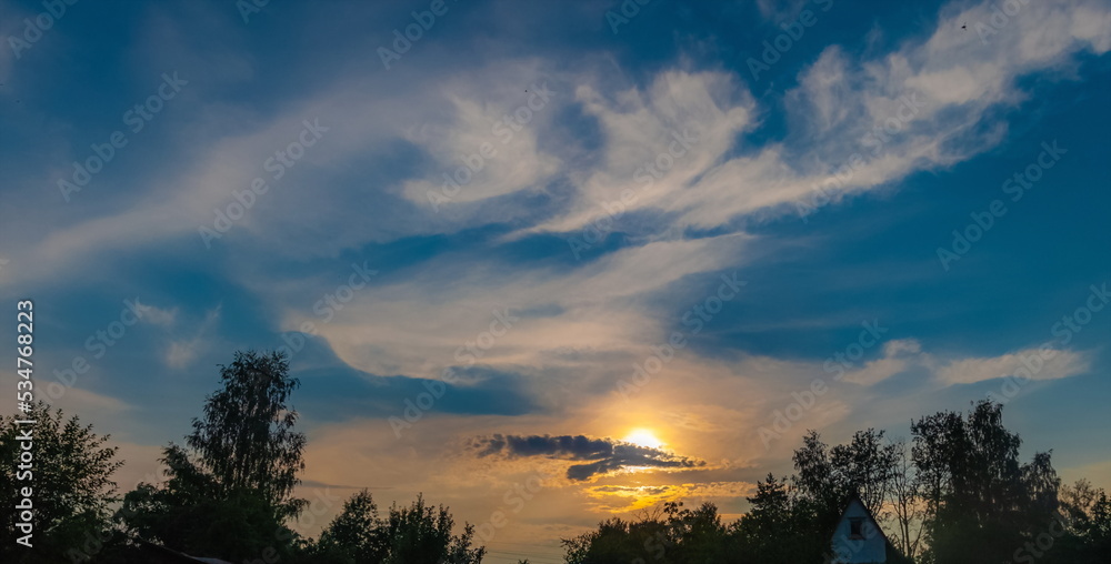 Obraz premium Landscape with sunset in the village in summer