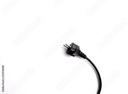 Black electrical cable isolated on white background, top view.