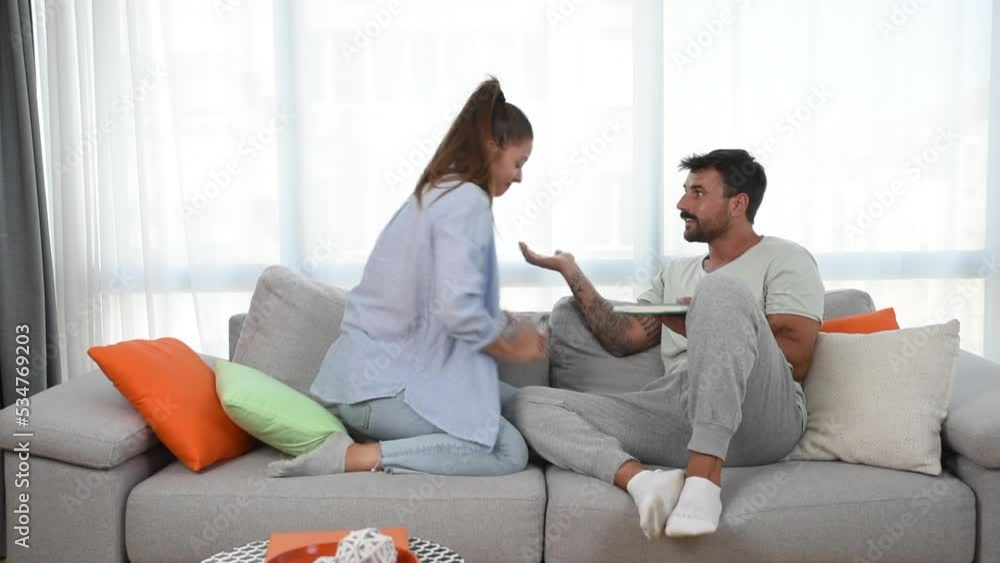Depressed young woman and man feeling sad while looking at the positive result of a pregnancy home test. Unwanted pregnancy couple problem causing stress and anxiety, bad contraception product concept Depressed young woman and man feeling sad while looking at the positive result of a pregnancy home test. Unwanted pregnancy couple problem causing stress and anxiety, bad contraception product concept