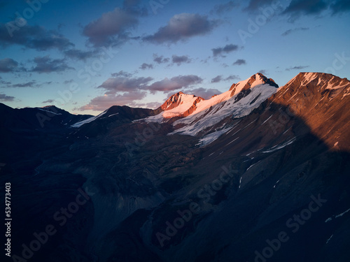 Beautiful landscape of the snowy mountains of Kazakhstan at sunset