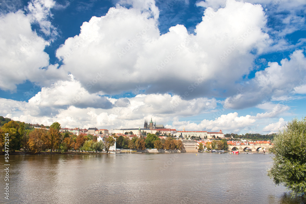 Panorama of Prague Castle and Charles bridge in autumn sunny day. Prague, Czech Republic.