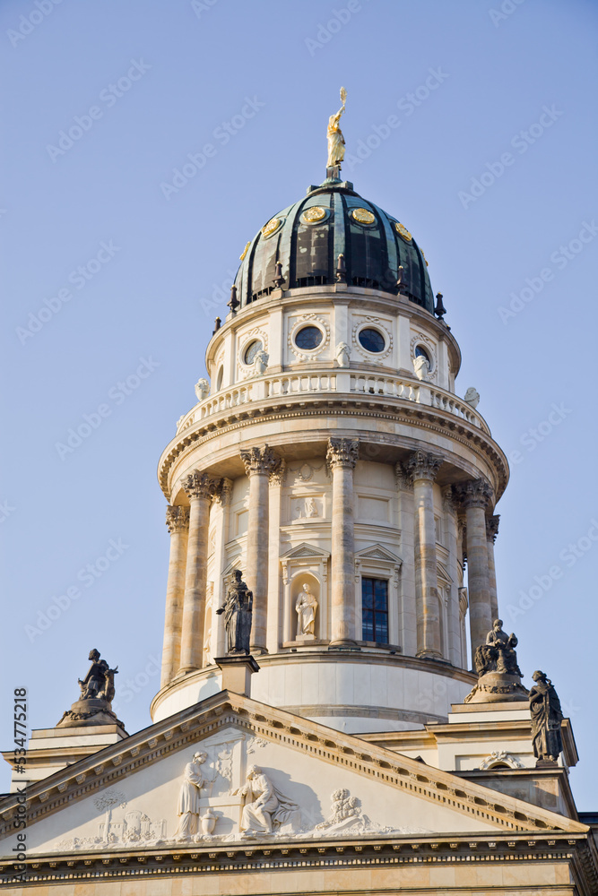 New Church (Deutscher Dom or German Cathedral) on Gendarmenmarkt, with the monument of Friedrich Schiller in the foreground. Berlin, Germany.