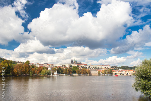 Panorama of Prague Castle and Charles bridge in autumn sunny day. Prague, Czech Republic.