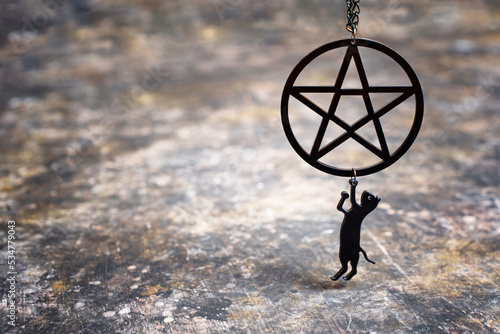 Pentagram necklace with small black cat pendant photo