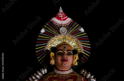 Statue of Yakshagana dace artist isolated on black background. Yakshagana is a traditional folk dance of India.