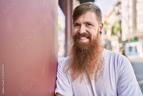Young redhead man smiling confident standing at street © Krakenimages.com