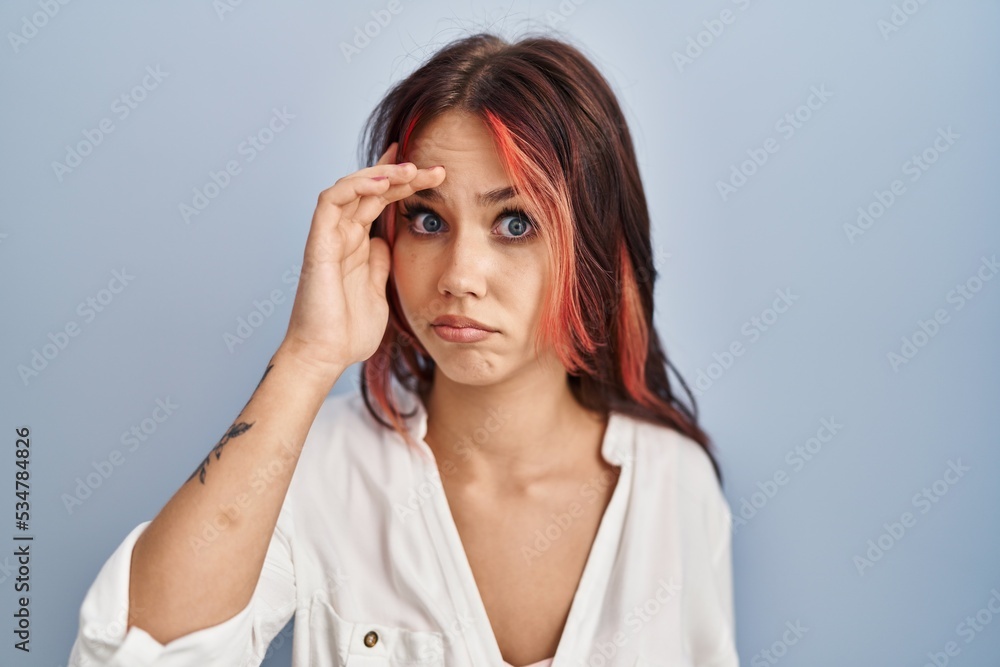 Young caucasian woman wearing casual white shirt over isolated background worried and stressed about a problem with hand on forehead, nervous and anxious for crisis Young caucasian woman wearing casual white shirt over isolated background worried and stressed about a problem with hand on forehead, nervous and anxious for crisis