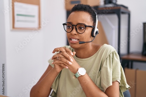 African american woman call center agent working at office