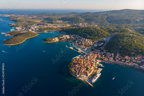 aerial view of the islands of korcula in croatia; croatian adriatic coast as seen from a drone; the town of korcula on the peljesac peninsula at sunset