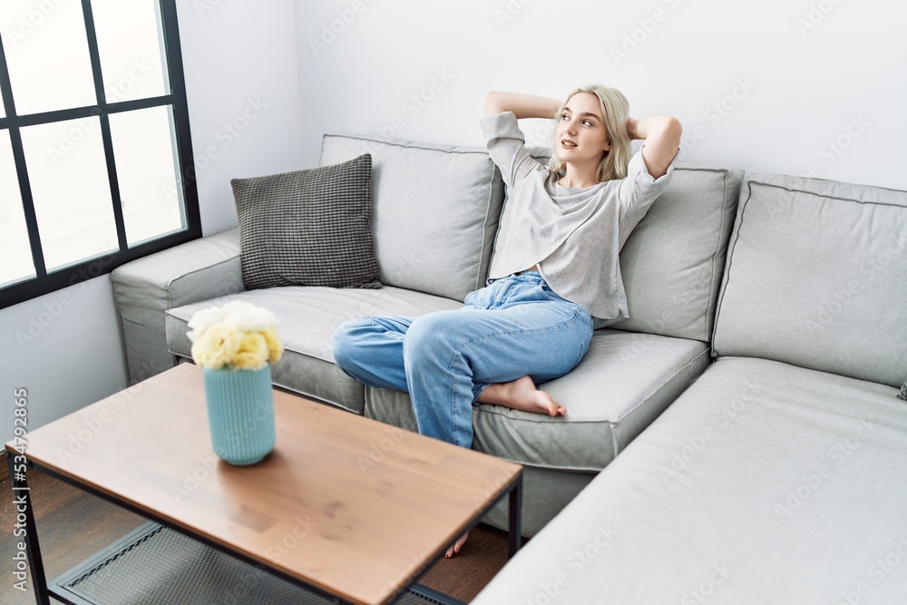 Young caucasian woman smiling confident relaxed with hands on head at home Young caucasian woman smiling confident relaxed with hands on head at home