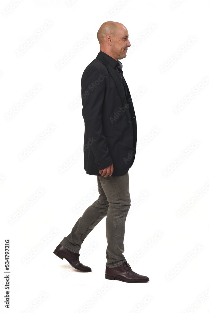 side view of a man with blazer and jeans walking on white background, side view of a man with blazer and jeans walking on white background,