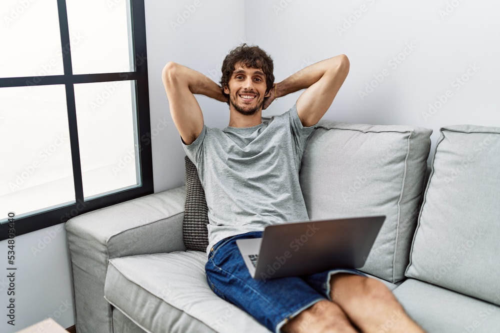 Young hispanic man smiling confident watching movie at home Young hispanic man smiling confident watching movie at home