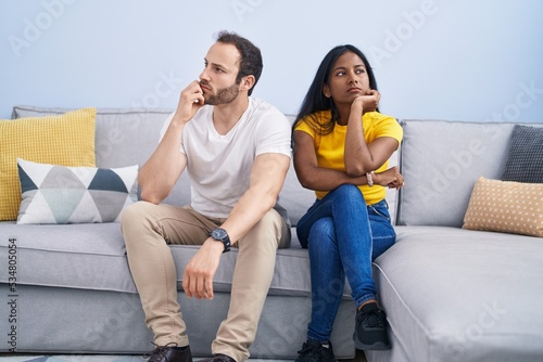 Man and woman interracial couple arguing at home