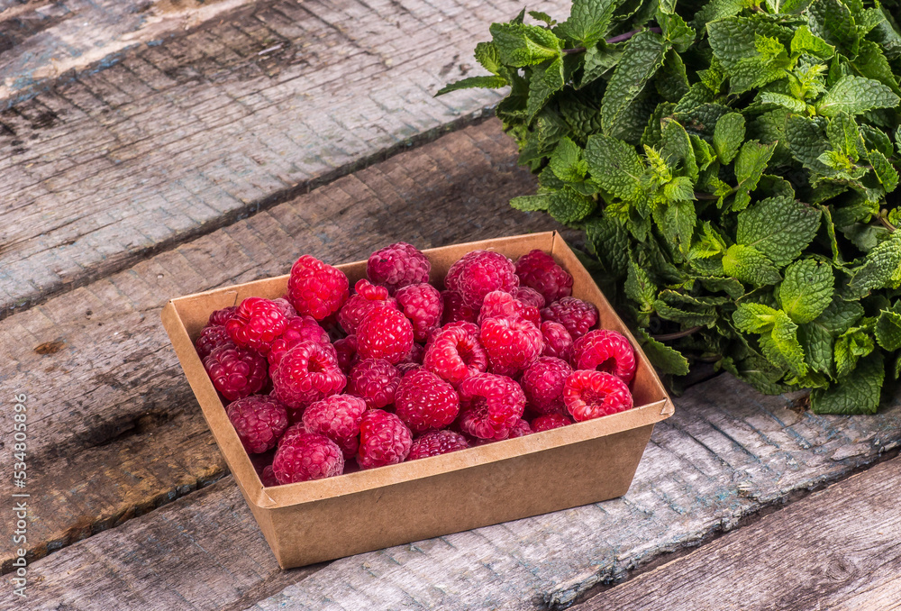 Eco-friendly box with raspberries. Frozen raspberry preparation