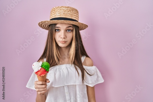 Teenager girl holding ice cream depressed and worry for distress, crying angry and afraid. sad expression.