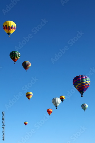 Hot air balloons ascending into the sky.