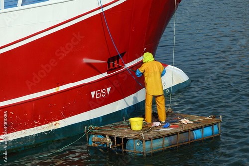 Photography Power washing a fishing trawler in Howth harbor, Co