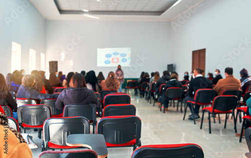classroom with students or professionals defocused background © oscargutzo