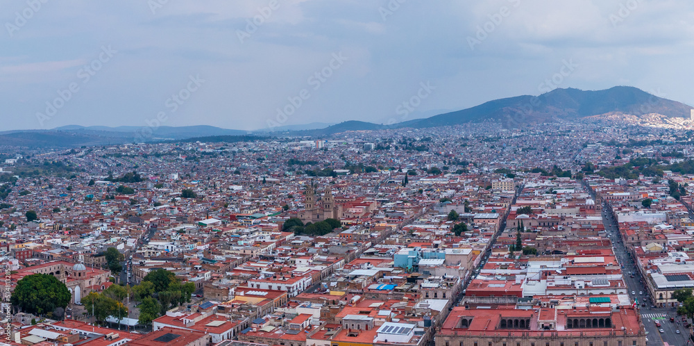 Aerial: scenic view of the landscape and cityscape in Morelia, Michoacan, Mexico. Drone view
